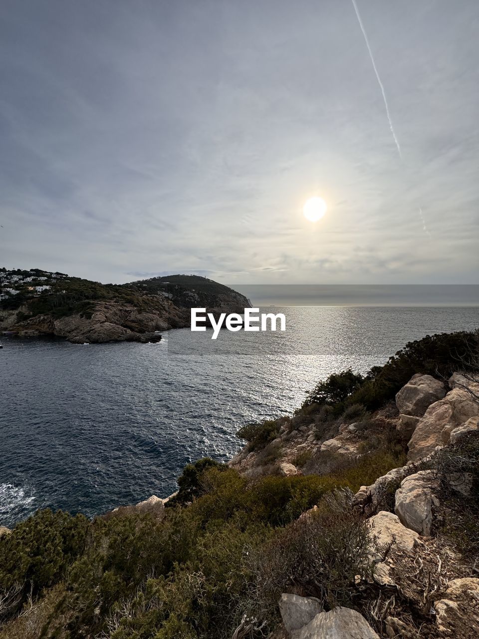 water, nature, reflection, sunlight, rock, beauty in nature, sky, scenics - nature, outdoors, no people, sun, day, mountain, tranquility, tree, panoramic, winter, environment, cave, sea, rock formation