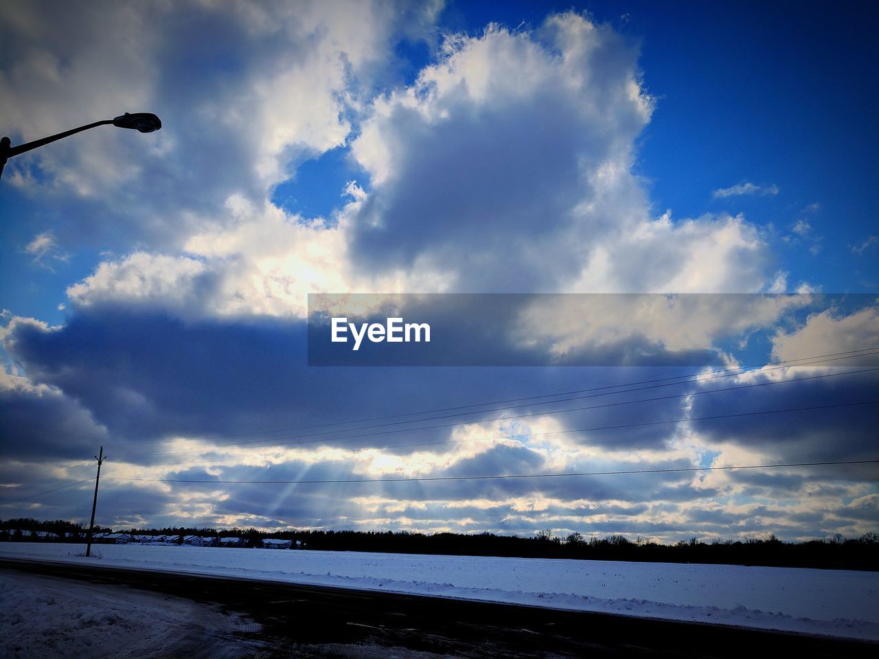 LOW ANGLE VIEW OF CLOUDS OVER WATER