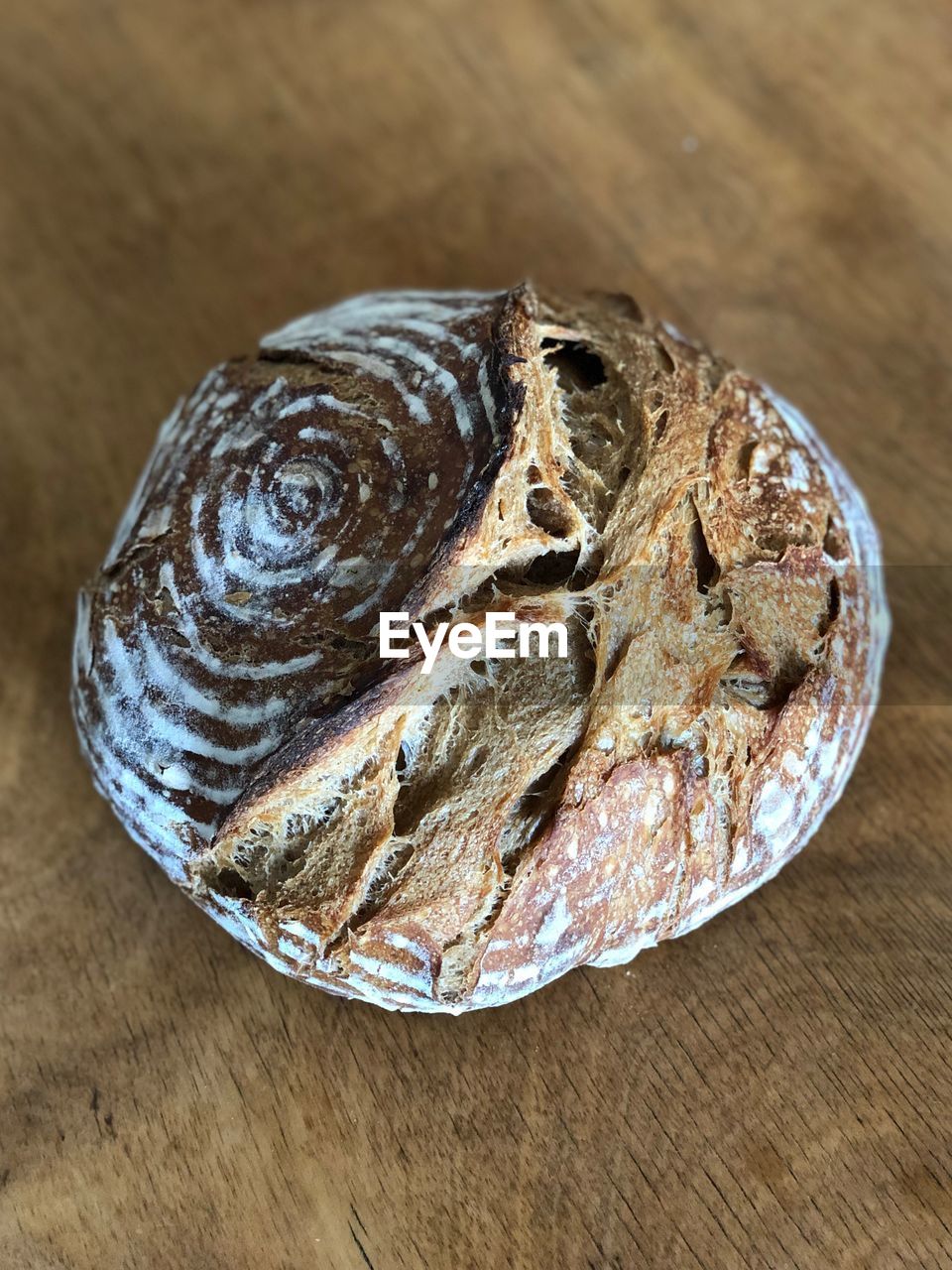 HIGH ANGLE VIEW OF BREAD ON WOOD