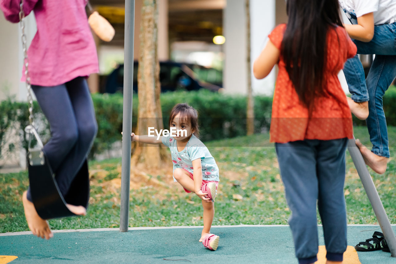 Siblings playing at playground