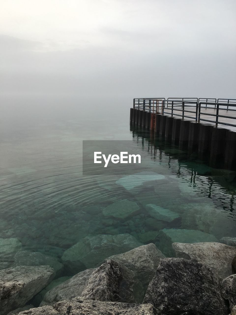 Pier on sea against sky