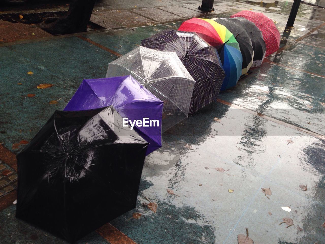 CLOSE-UP HIGH ANGLE VIEW OF MULTI COLORED UMBRELLAS