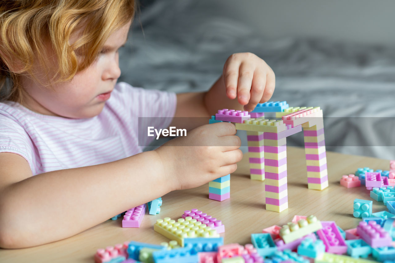 Boy playing with toy on table