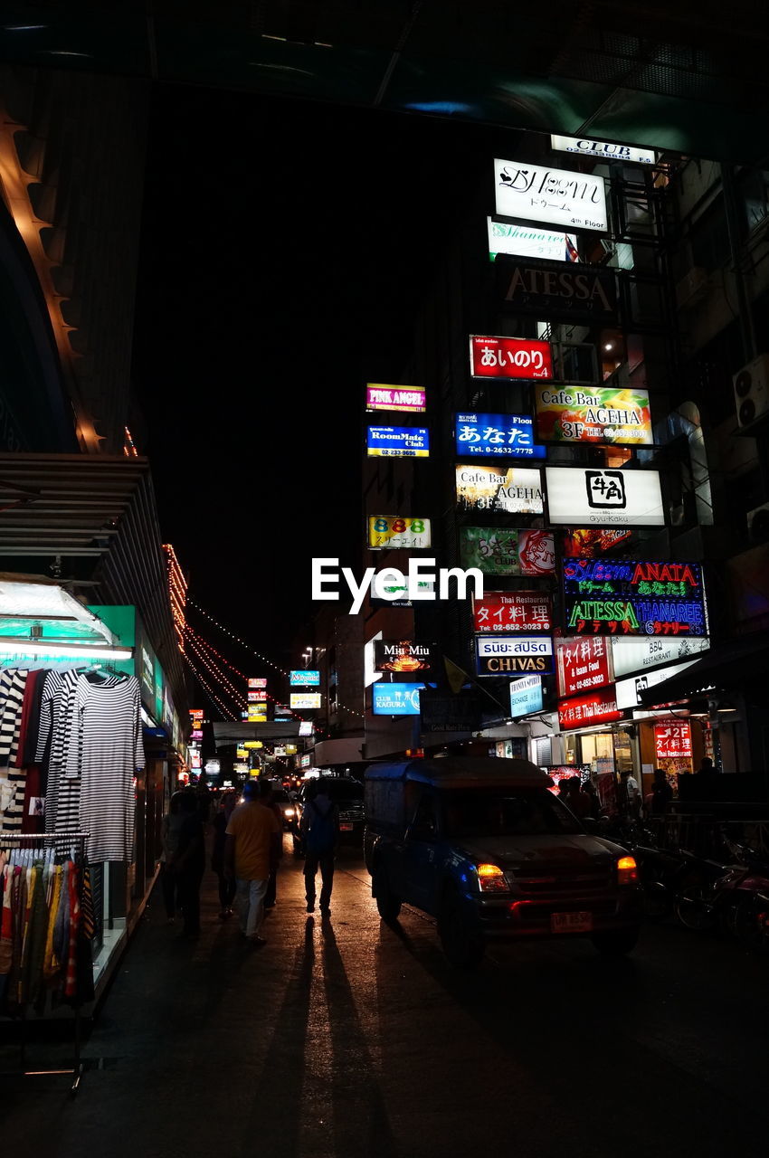 ILLUMINATED CITY STREET AT NIGHT