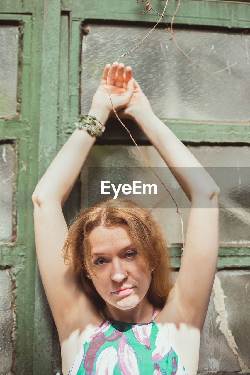 Close up smiling woman posing with arms up portrait picture