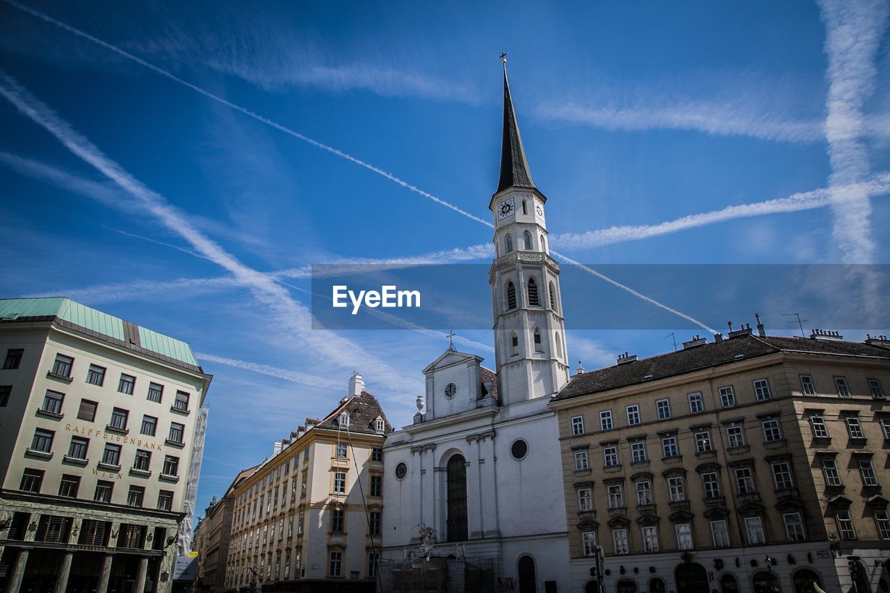 VAPOR TRAIL AGAINST BLUE SKY