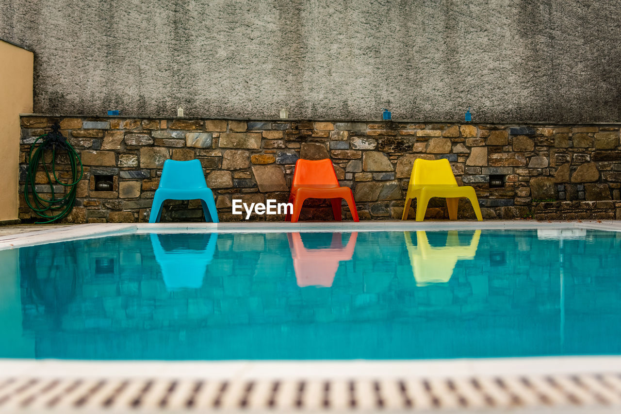 View of swimming pool against wall