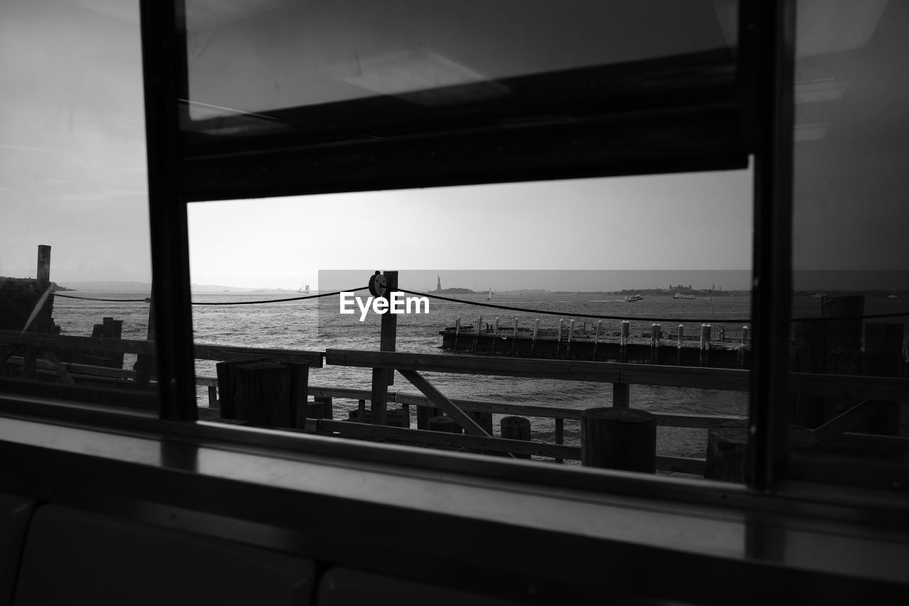 VIEW OF SEA SEEN THROUGH WINDOW