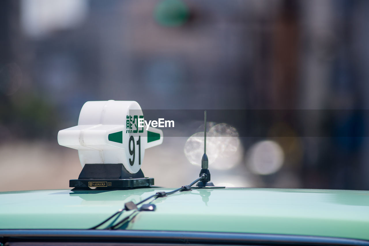 CLOSE-UP OF TELEPHONE BOOTH ON TABLE