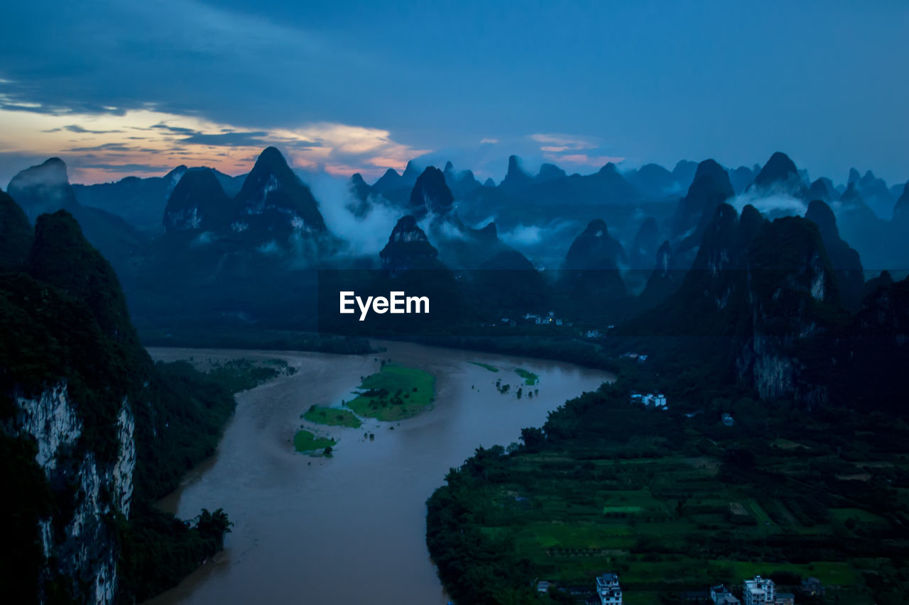 Scenic view of mountains against sky during sunset