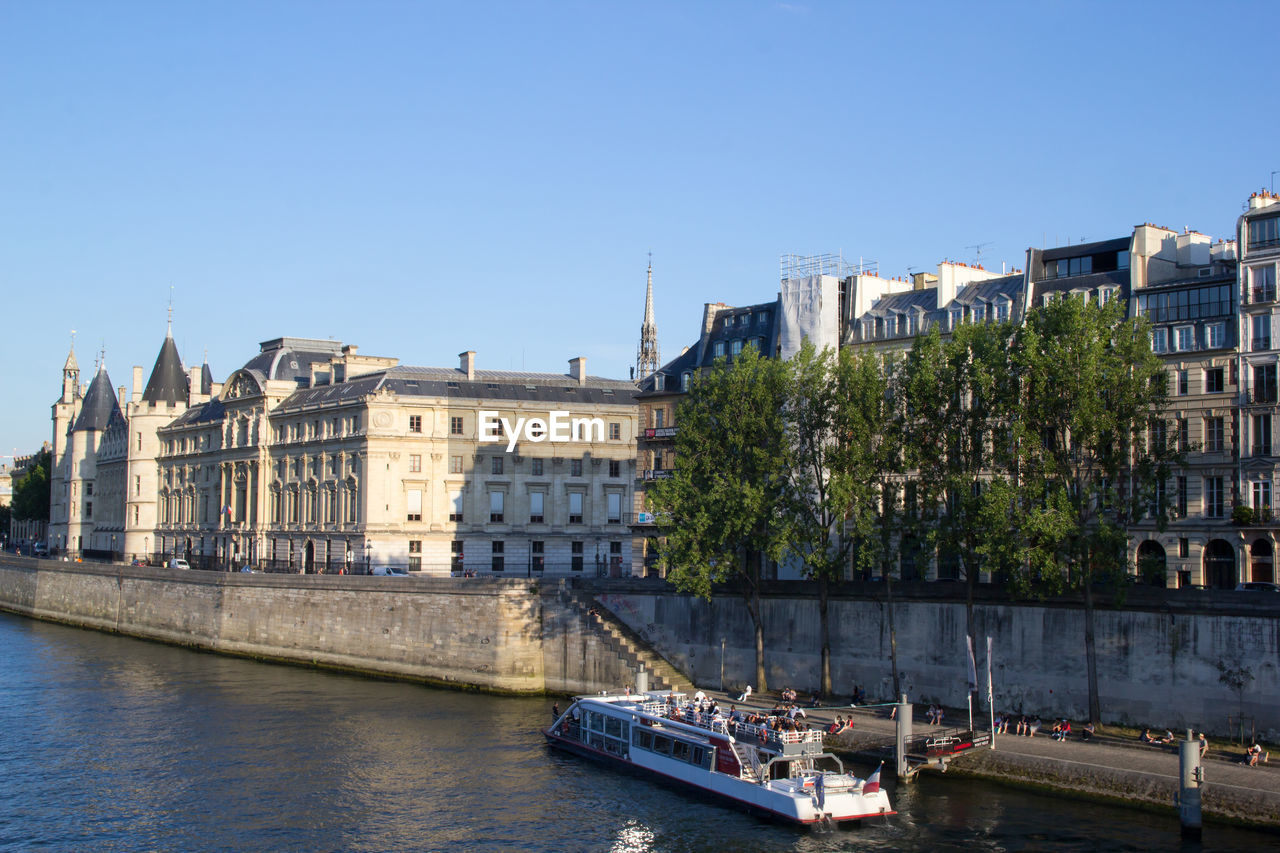 View of buildings in city against clear sky