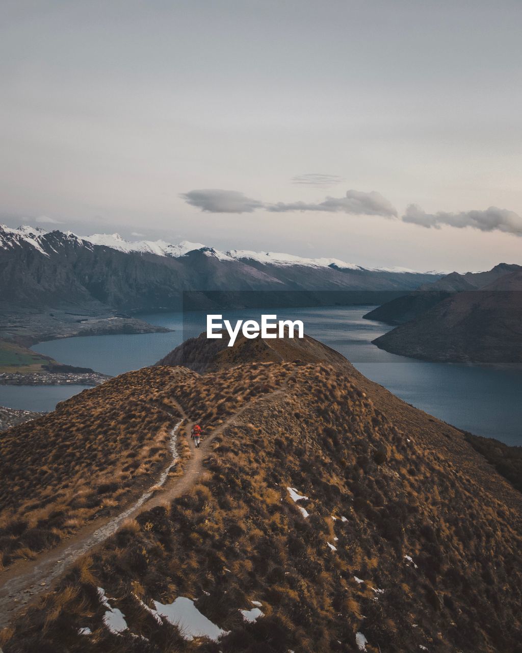 Scenic view of sea and mountains against sky