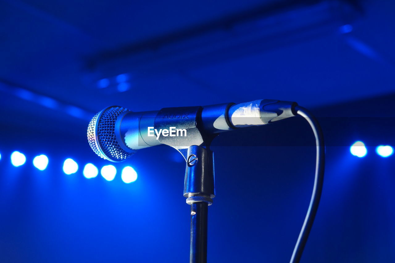 Midsection of microphone on stage