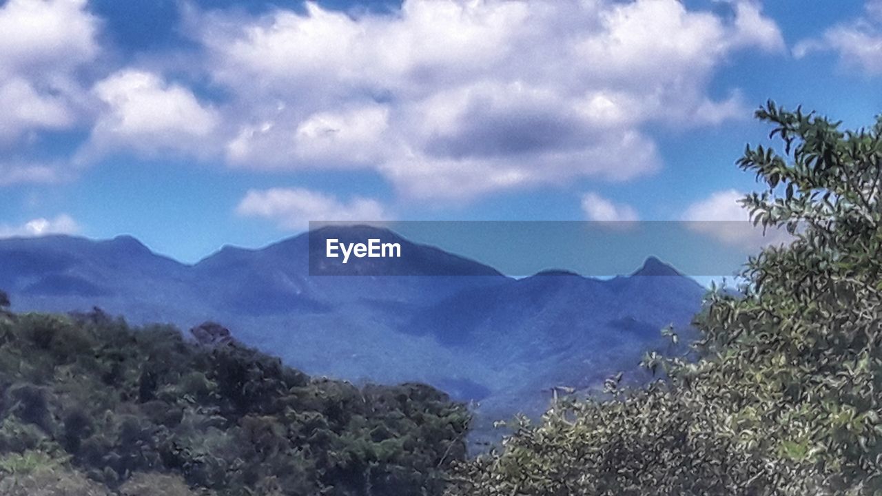 PANORAMIC VIEW OF MOUNTAINS AGAINST SKY