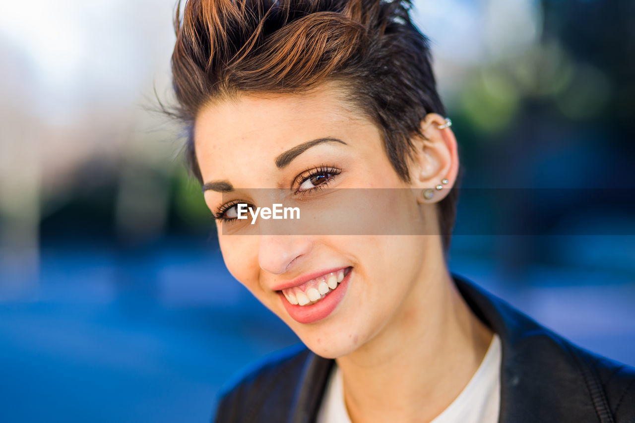 Portrait of smiling woman outdoors