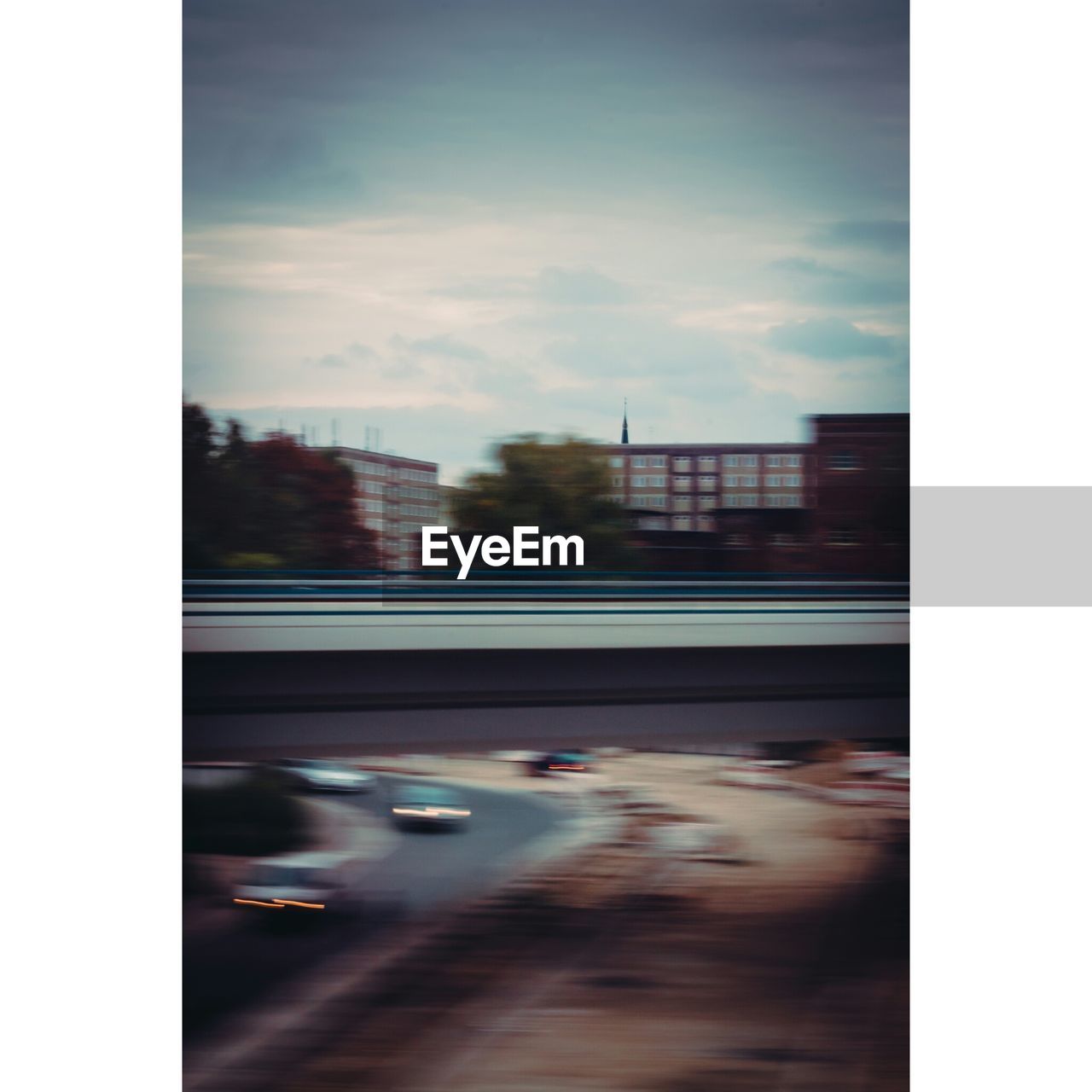 DEFOCUSED IMAGE OF CAR ON ROAD IN CITY