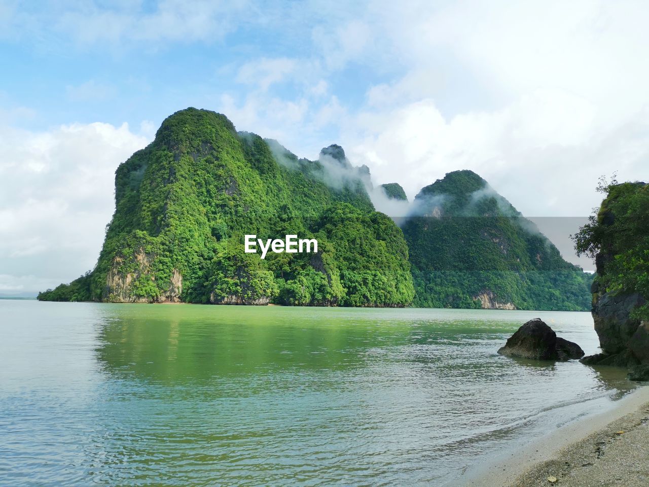 water, scenics - nature, sky, land, beauty in nature, sea, cloud, nature, body of water, beach, mountain, tree, coast, bay, tranquility, rock, plant, environment, shore, tranquil scene, no people, cliff, islet, landscape, travel destinations, island, travel, terrain, cove, outdoors, idyllic, day, lagoon, non-urban scene, green, tourism, coastline, forest, rock formation, tropical climate, trip, vacation, holiday, ocean, bay of water