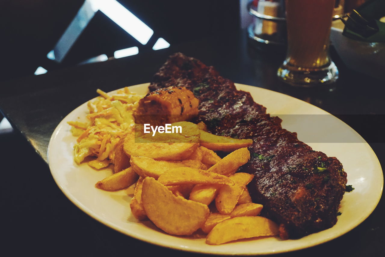 CLOSE-UP OF MEAT AND SALAD