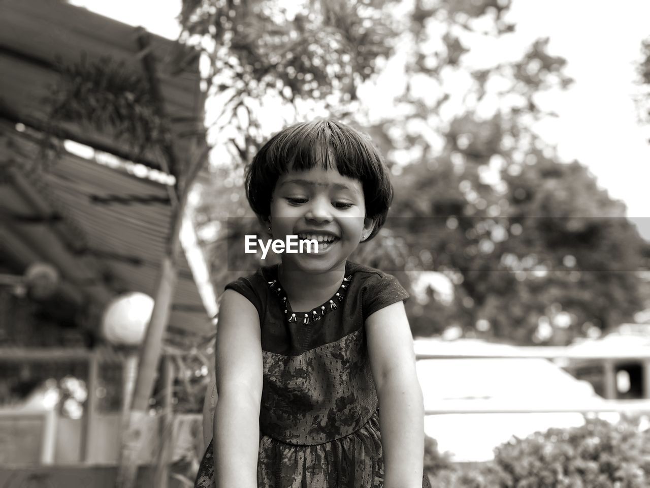 Portrait of smiling girl playing outdoors