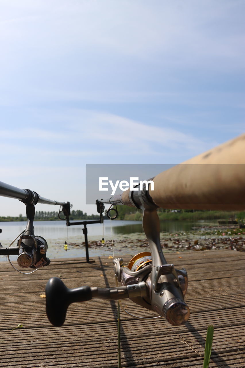 bicycle, nature, vehicle, day, sky, low angle view, technology, outdoors, mast, sunlight, sports, one person