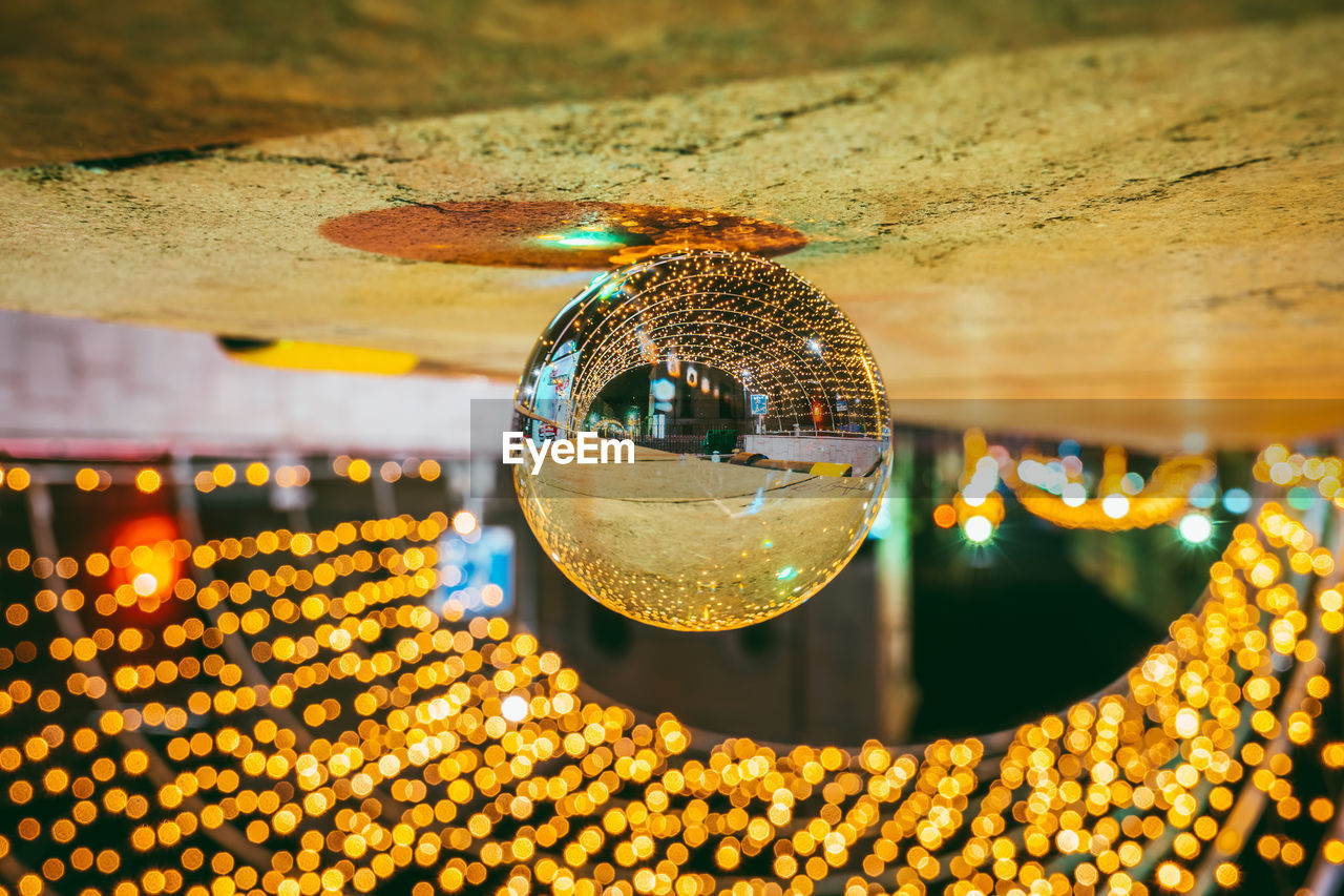 CLOSE-UP OF ILLUMINATED LIGHTING EQUIPMENT