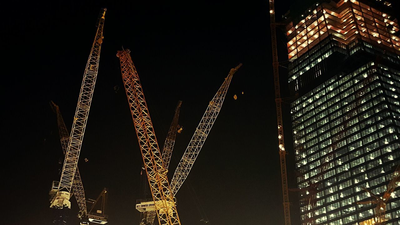 LOW ANGLE VIEW OF ILLUMINATED SKYSCRAPER