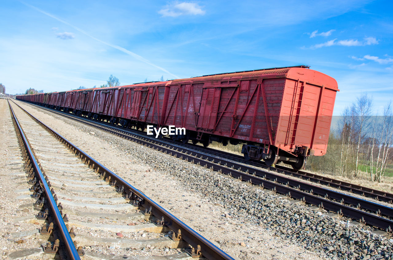 Freight train against sky
