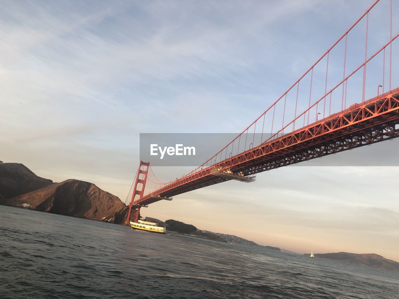 Low angle view of suspension bridge against sky