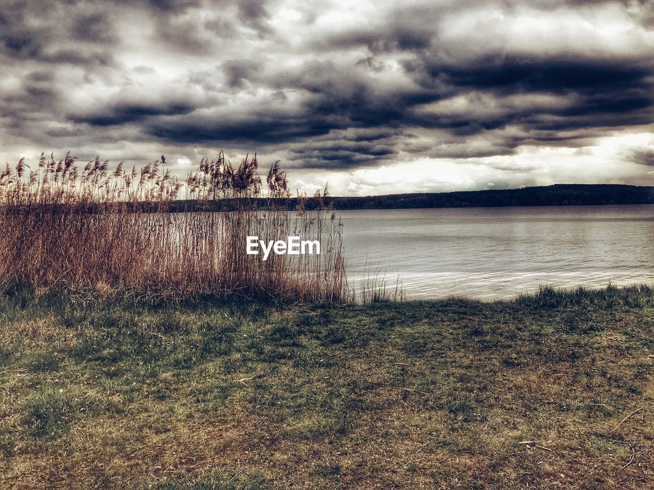 VIEW OF STORM CLOUDS OVER LANDSCAPE