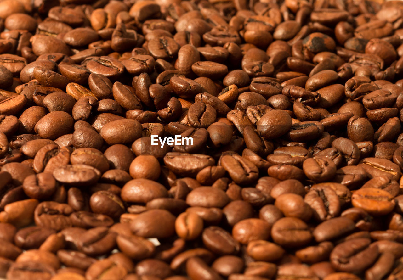 FULL FRAME SHOT OF COFFEE BEANS IN BACKGROUND