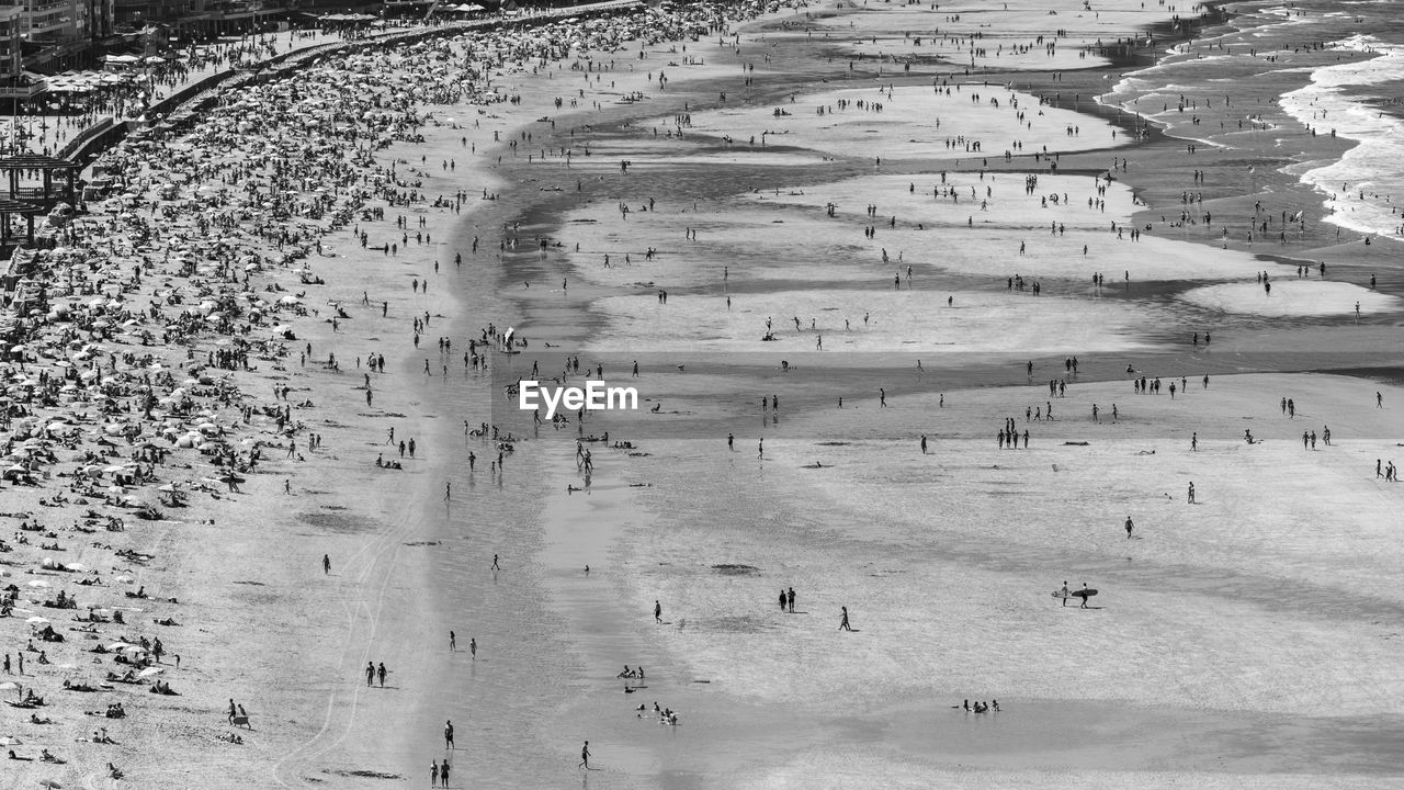 HIGH ANGLE VIEW OF PEOPLE AT BEACH