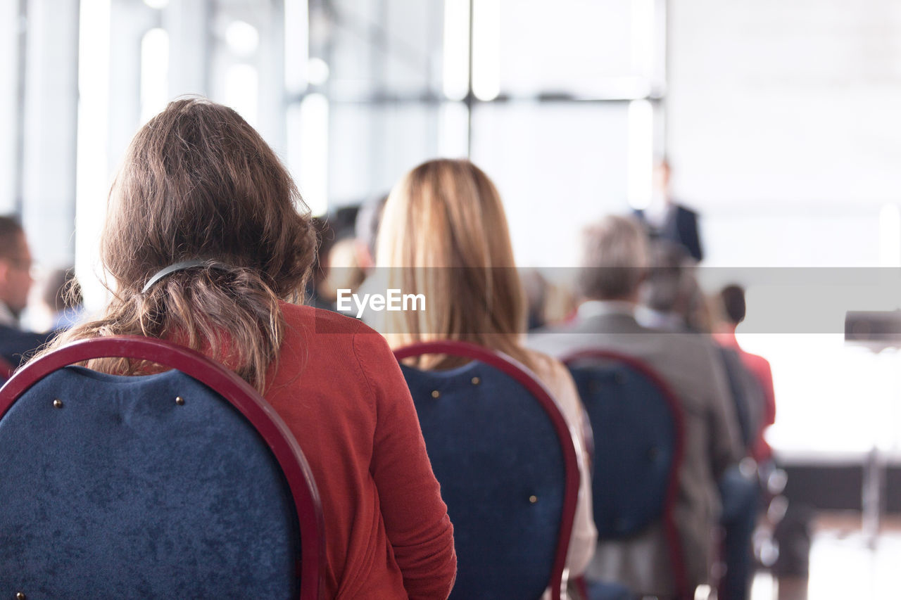 Rear view of people in seminar