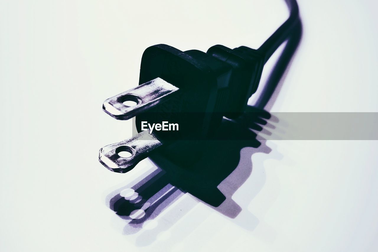 Close-up of plug against white background