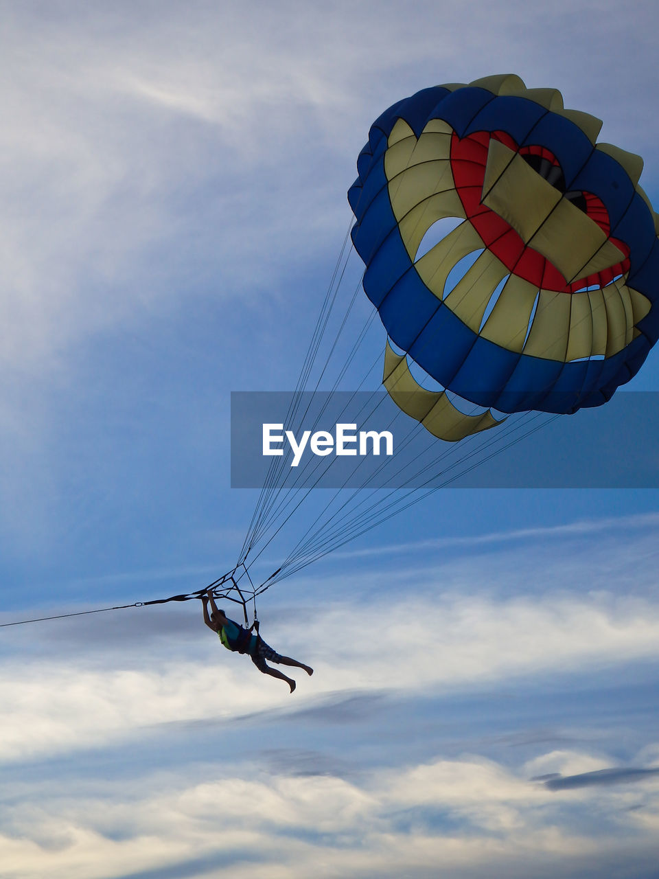 LOW ANGLE VIEW OF HELICOPTER FLYING IN SKY