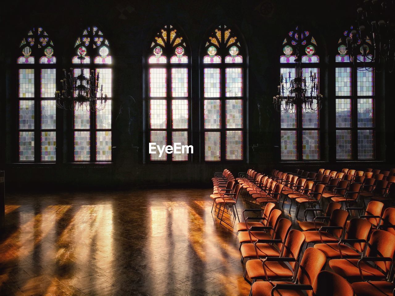 Empty chairs and tables in building