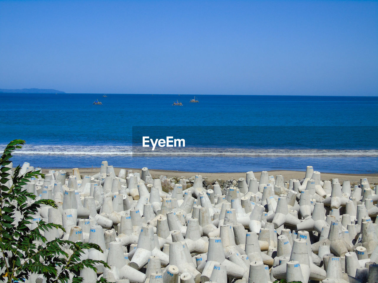 SCENIC VIEW OF BEACH AGAINST CLEAR SKY