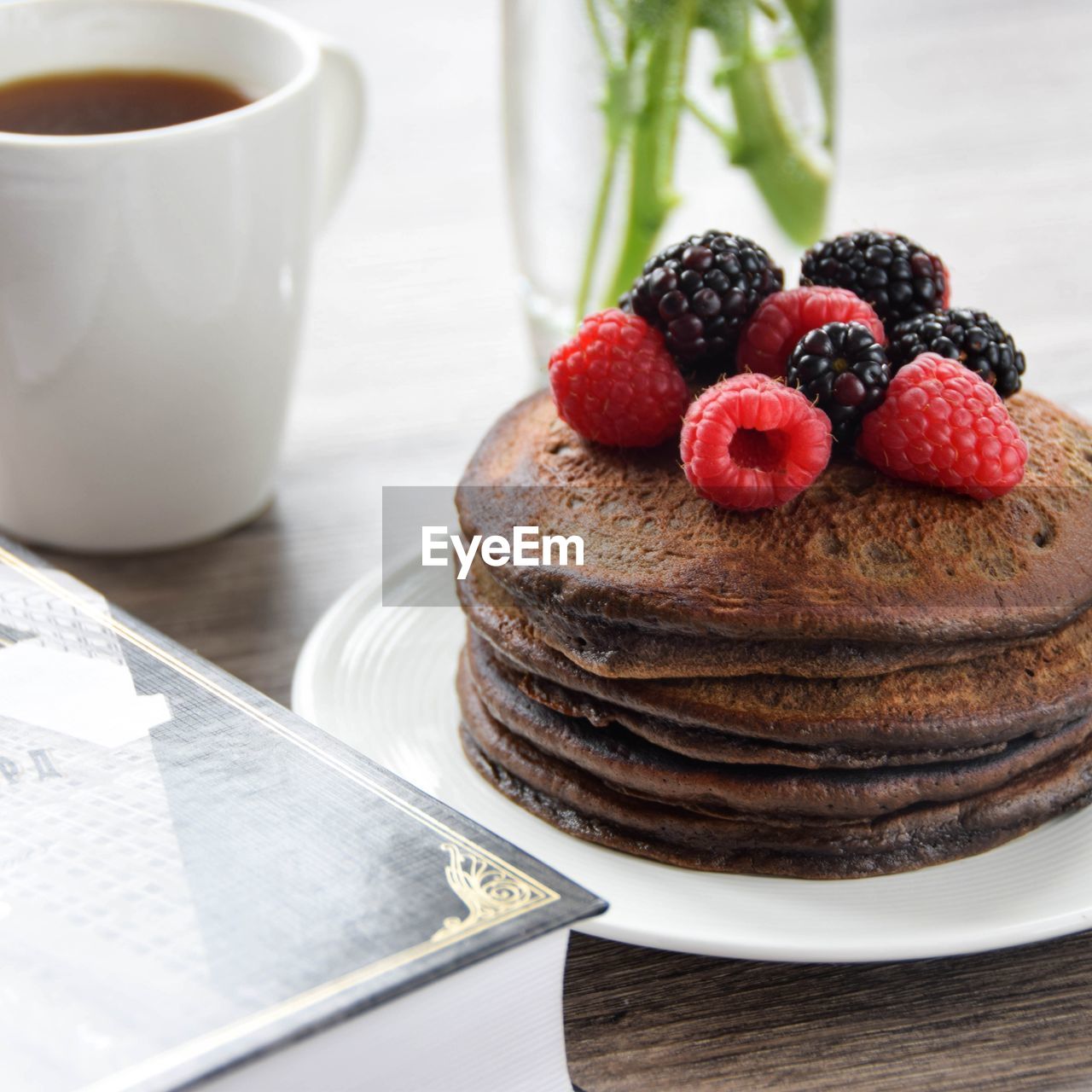 Close-up of berries on chocolate pancakes in plate