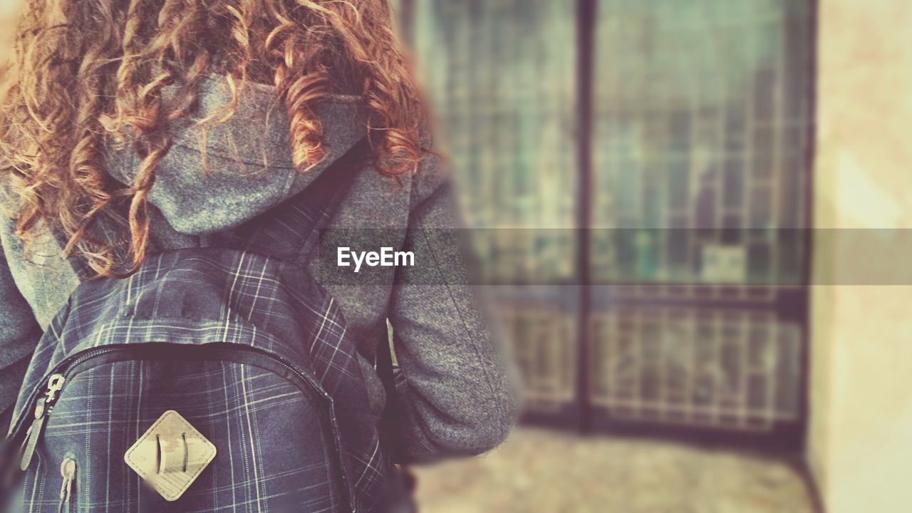 Rear view of girl going school