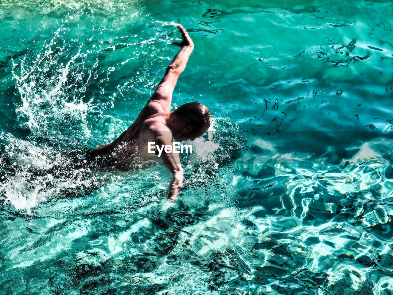 High angle view of man swimming in sea