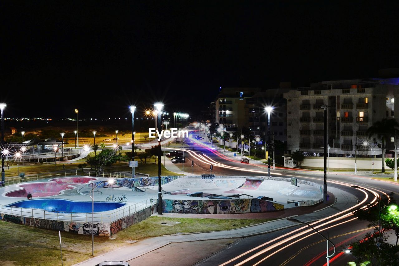 High angle view of light trails on road at night