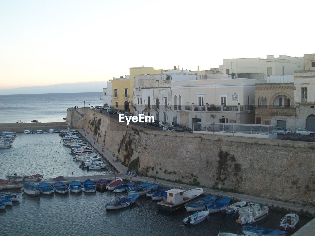 PANORAMIC VIEW OF SEA AGAINST BUILDINGS IN CITY