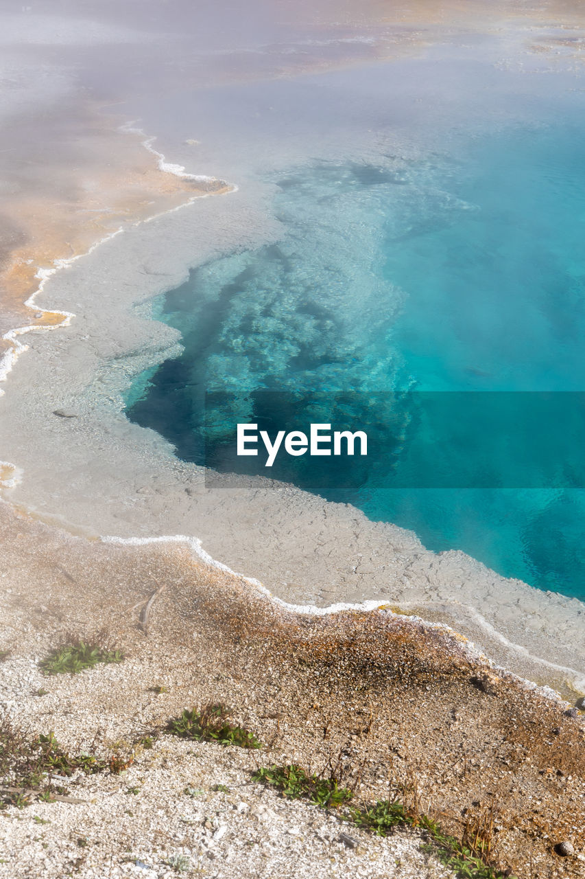 Brilliant blue thermal pool in west thumb basin in yellowstone national park