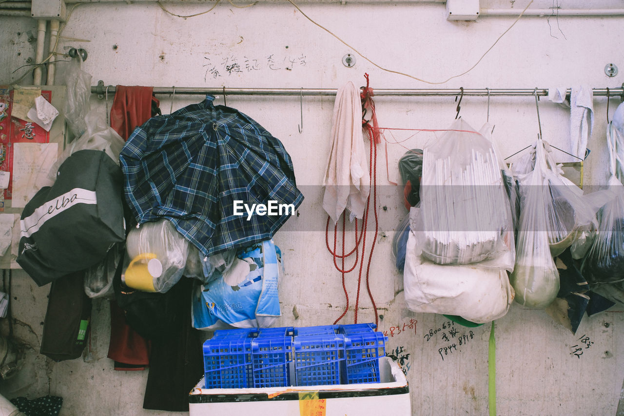 Objects hanging from rack against wall at home