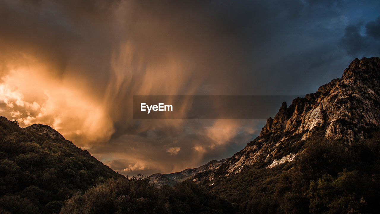 Low angle view of mountain against sky during sunset