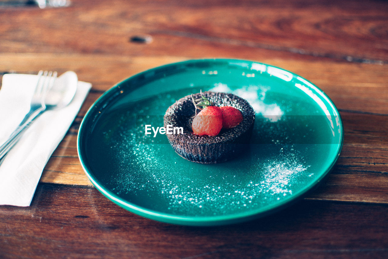 food and drink, food, blue, plate, table, wood, freshness, tableware, sweet food, dessert, sweet, berry, sweetness, fruit, fork, green, indoors, healthy eating, cake, eating utensil, kitchen utensil, red, no people, produce, still life, wellbeing, baked, high angle view, icing, close-up, temptation, strawberry