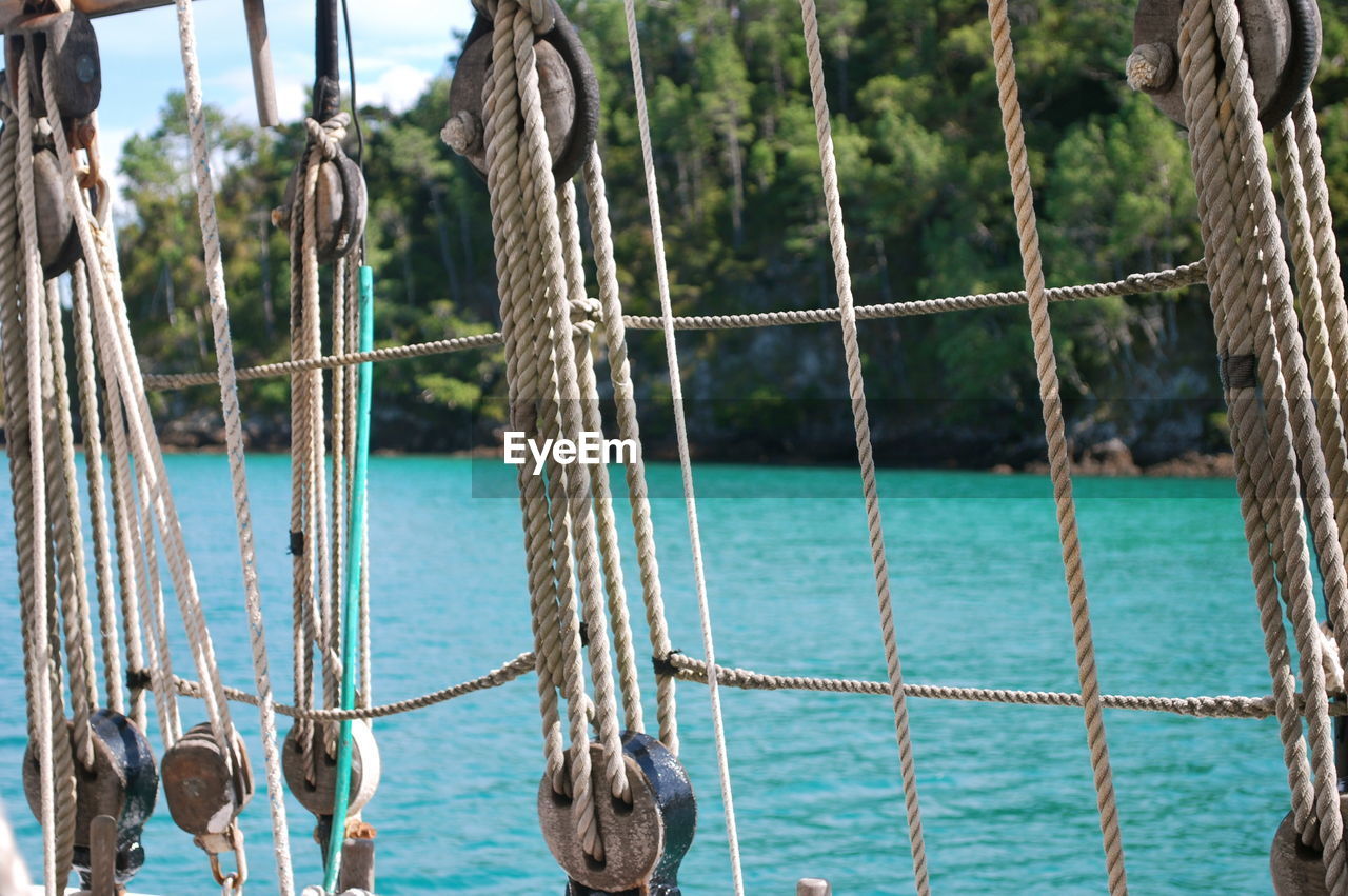 CLOSE-UP OF ROPES TIED ON ROPE