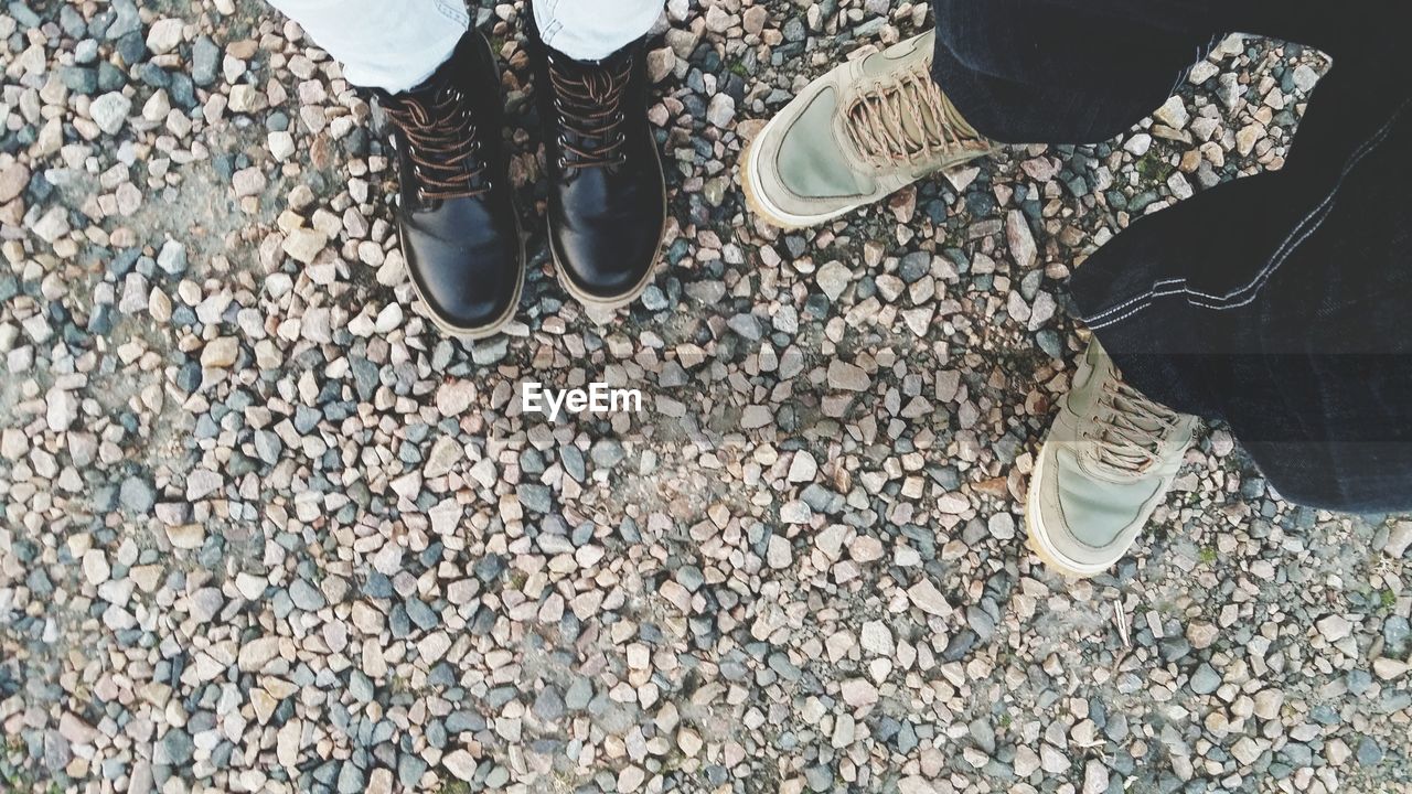 Low section of people standing on street