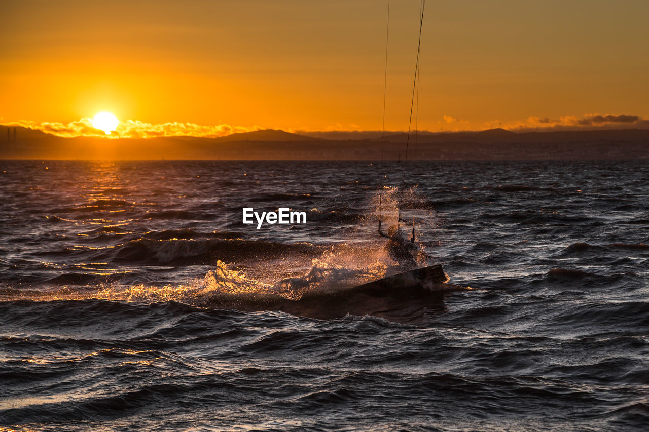 VIEW OF SEA AGAINST SKY DURING SUNSET