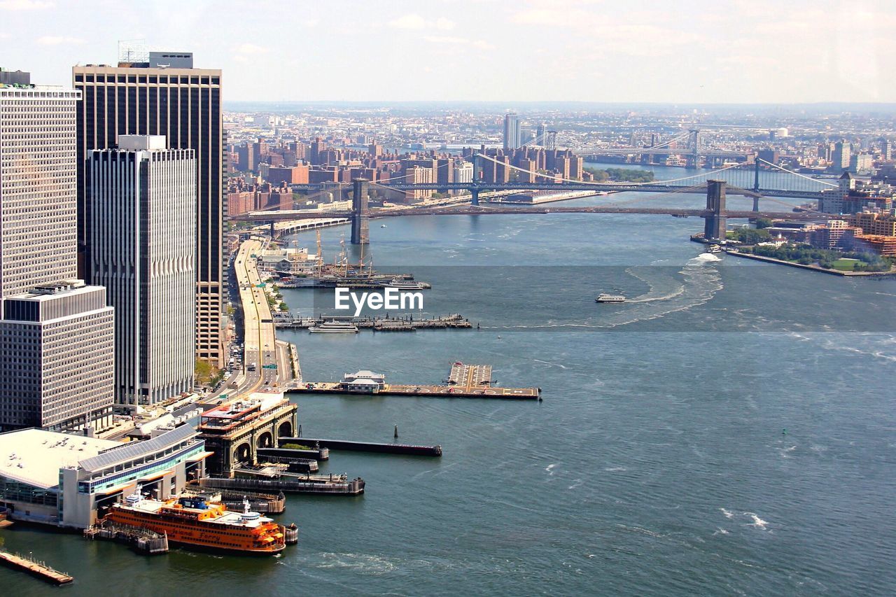 High angle view of river by buildings against sky