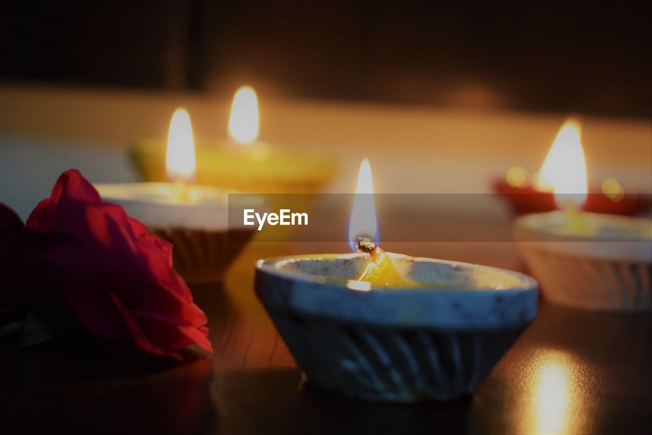 Close-up of illuminated diyas